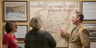 A professor explaining an exhibit in the Sandoz center